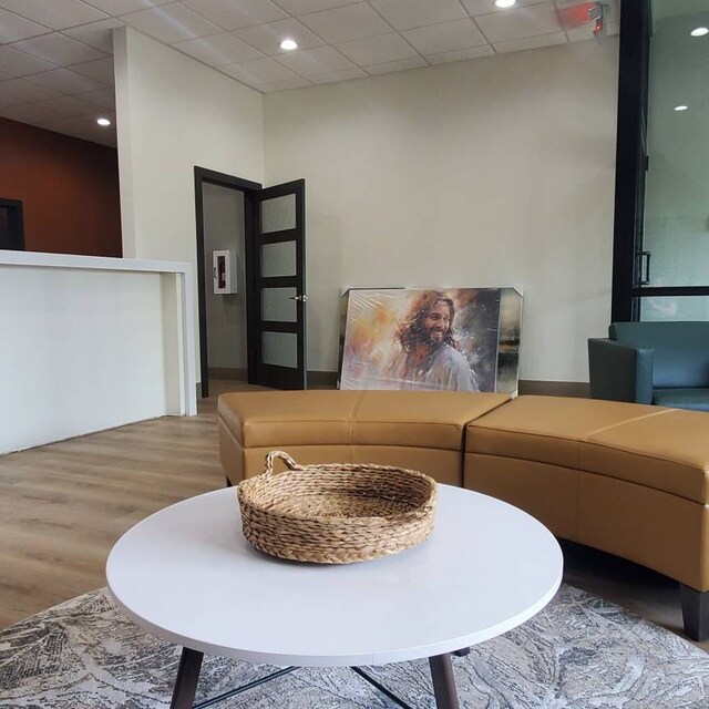 Smiling Jesus print in modern office waiting area